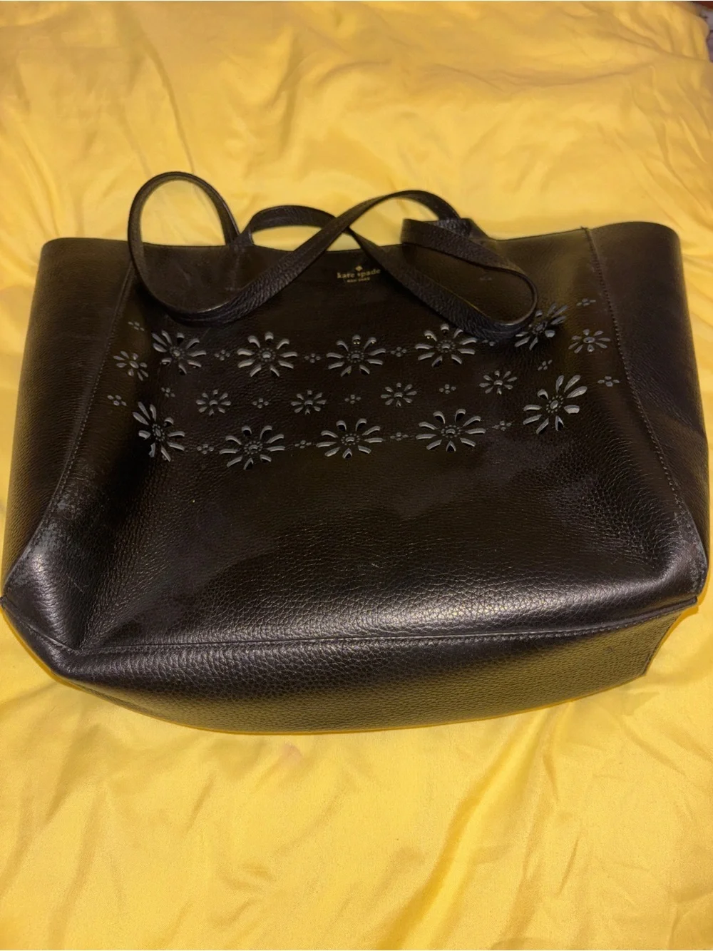 kate spade black leather tote with floral cutouts